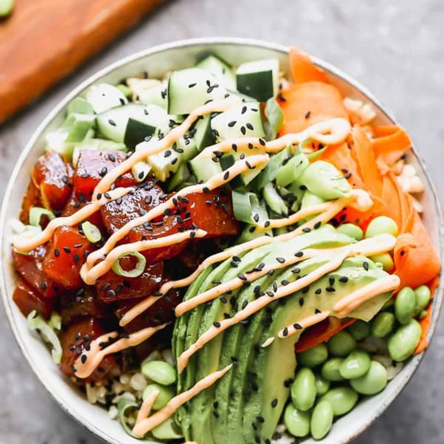 Poke bowl with salmon, tuna and fresh toppings